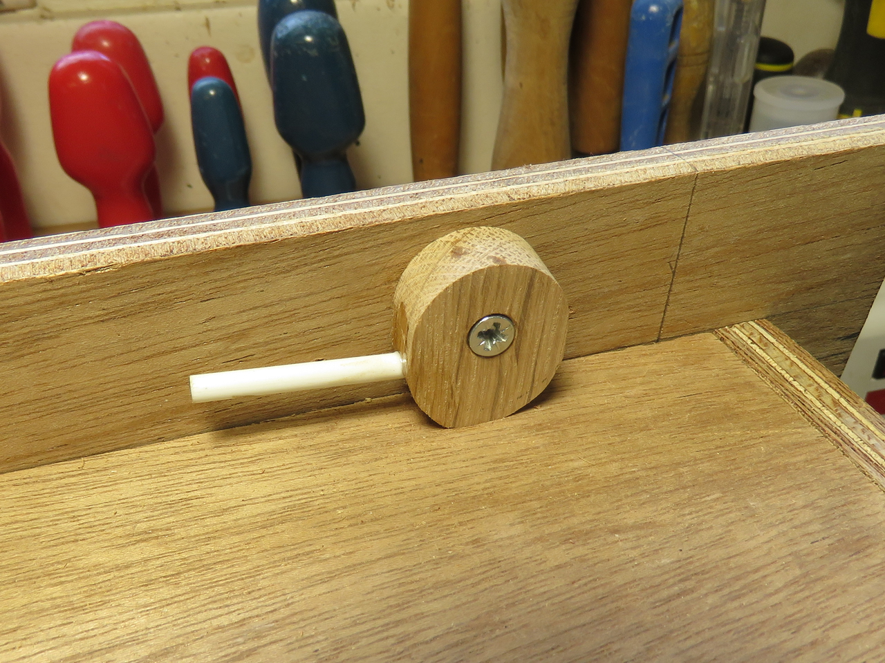 fastening cams at the top of the access door