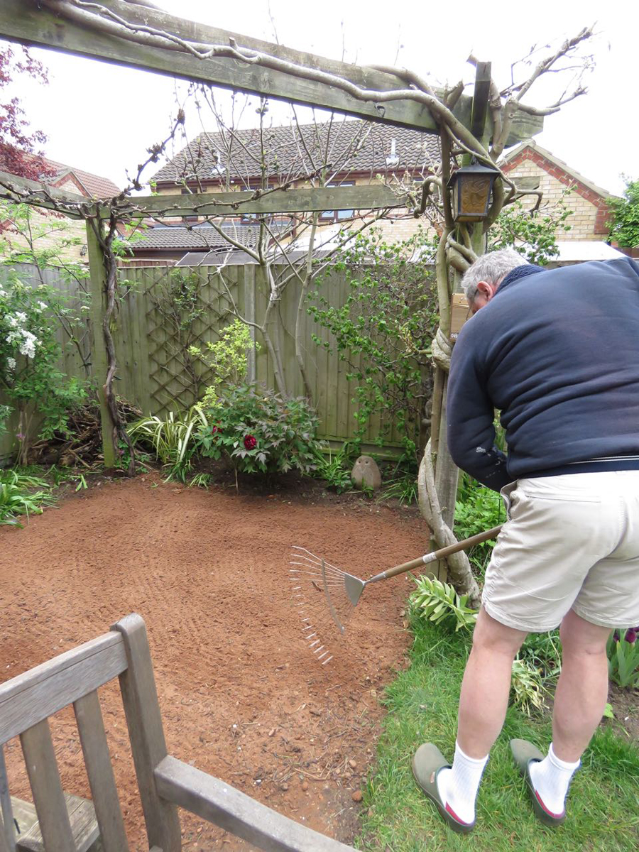 tamping down and racking it it flat.